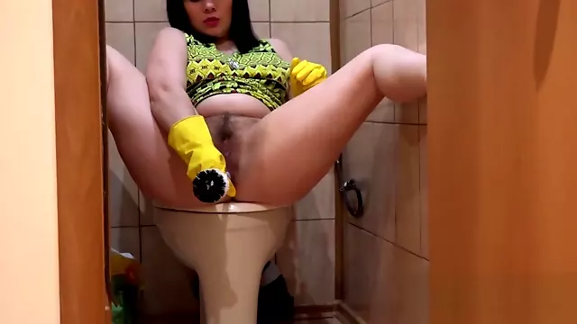 The girl, masturbates ass toilet brush